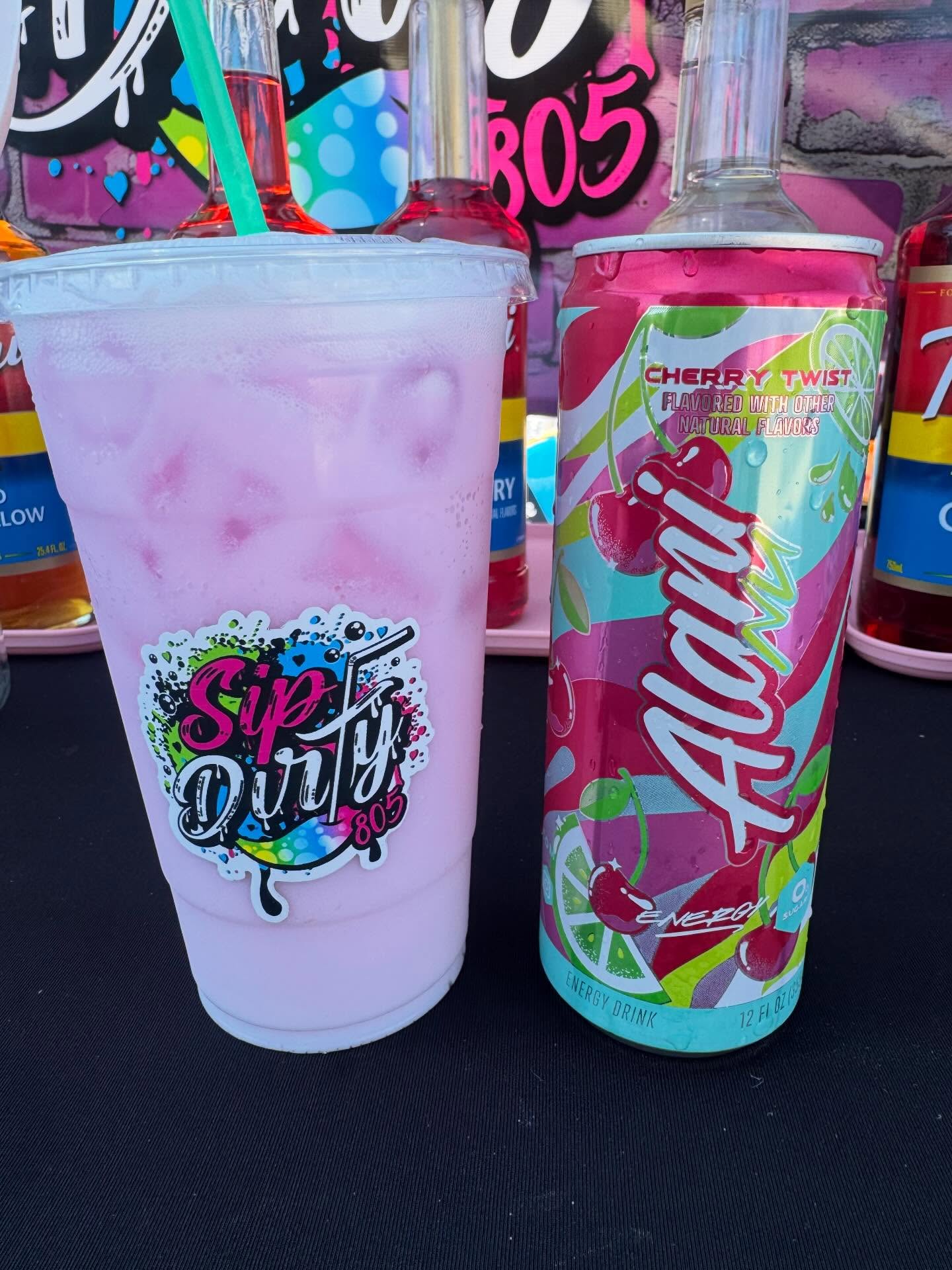 Pink Ventura Vice dirty soda next to a cherry Alani energy can — Sip Dirty 805